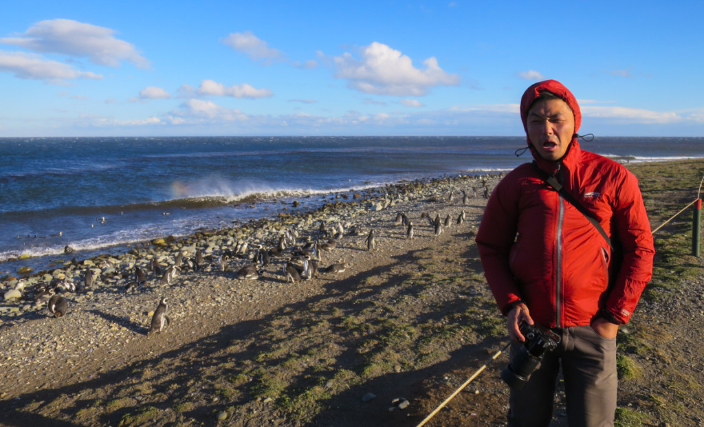 Trying the resist the strong winds at Isla Magdalena, Chile (Photo Credit: John Van)