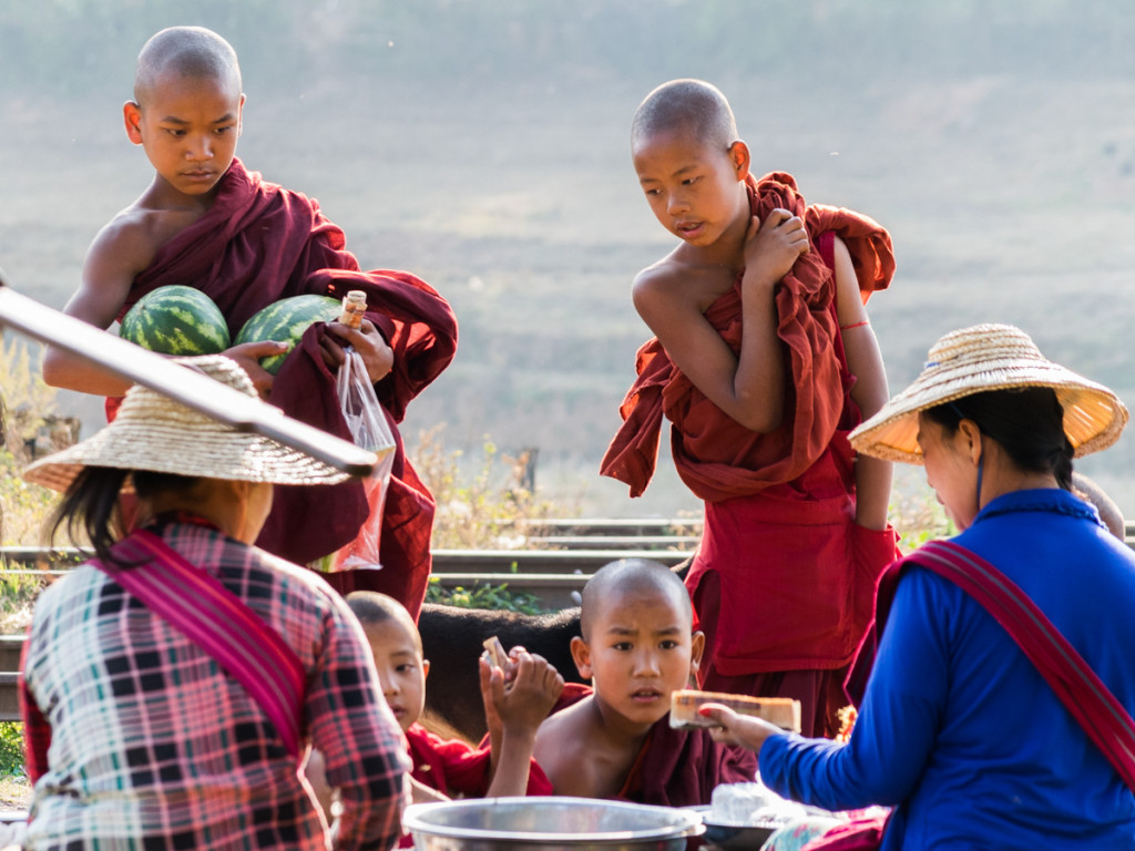 Monks buying fruits, train station, Myanmar